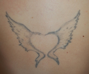 Heart wings tattoo