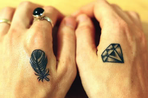 diamond and feather tattoo
