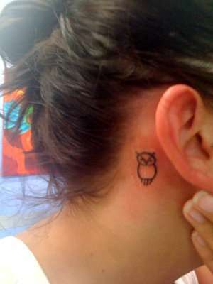 owl feather tattoo behind ear